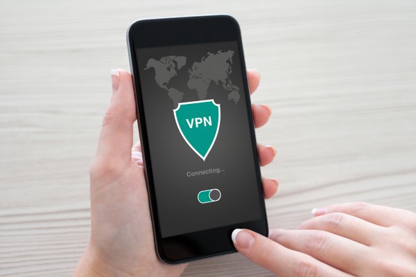 turbovpn android devices vpn service hand holding smartphone connecting to vpn 